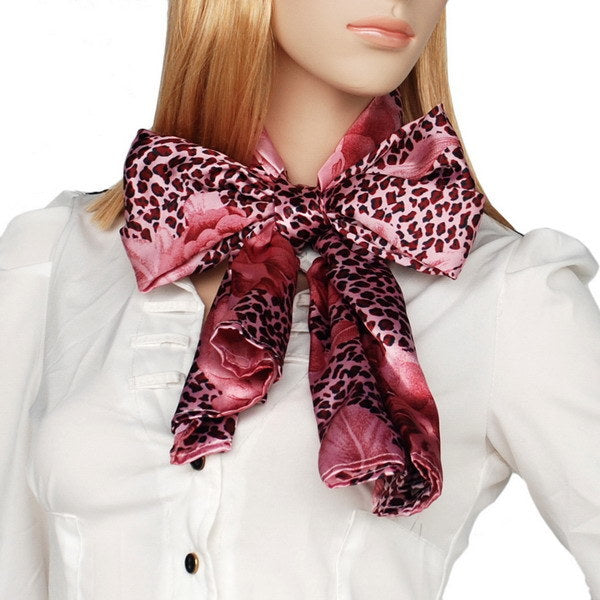 Silk scarf with burgundy leopard print and rose floral bows, worn at neckline