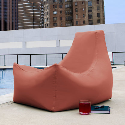 Coral bean bag patio chair with high backrest and relaxed wedge shape