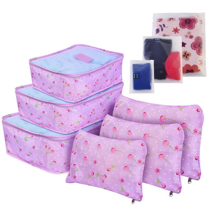 Pink patterned travel packing cube set with zippered compartments and matching accessory bags