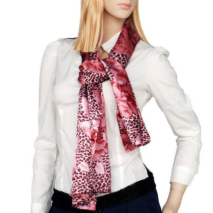 Silk scarf/wrap with burgundy leopard print and rose floral pattern, worn with white shirt
