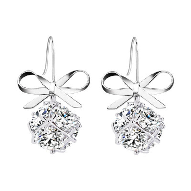 Silver-tone bow hook earrings with ribbon bow and round zircon drop stones