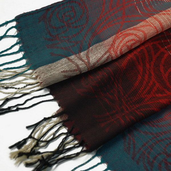 Close-up of pashmina shawl border with teal and red patterned fabric
