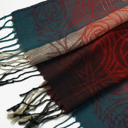 Close-up of pashmina shawl border with teal and red patterned fabric