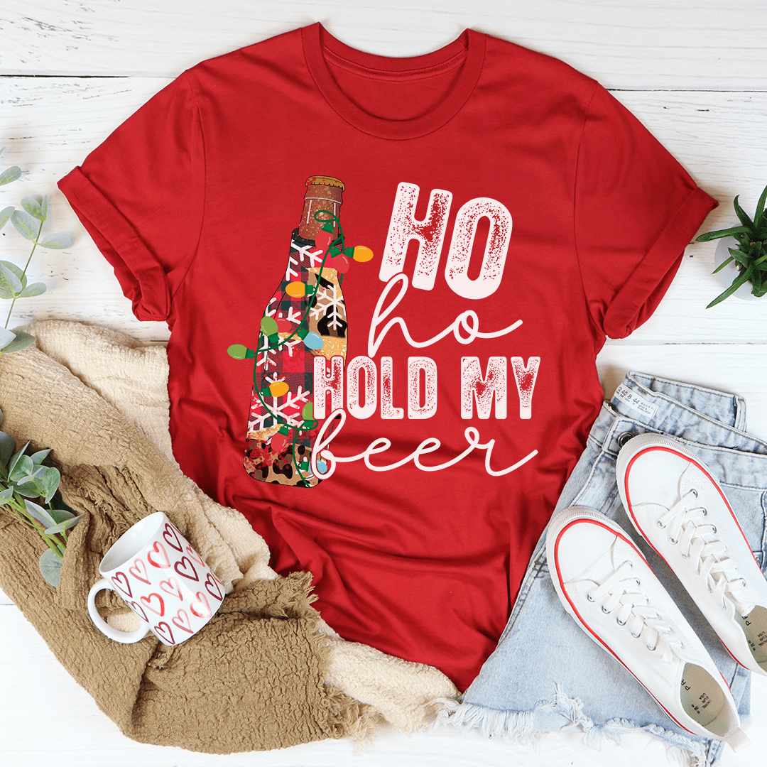 Red T-shirt with crew neck and festive bottle graphic reading “Ho ho hold my beer”