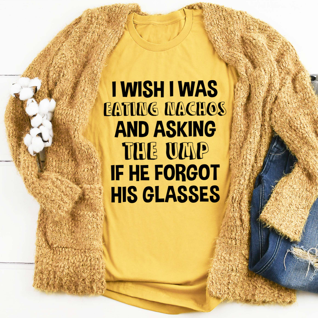 Mustard yellow T-shirt with bold black front text graphic.