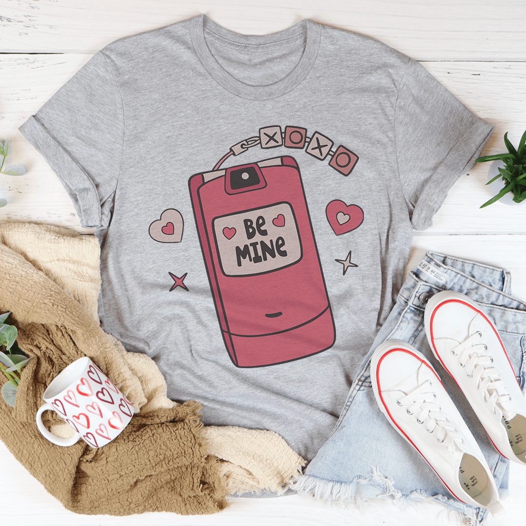 XOXO flip phone T-shirt in heather gray with “Be Mine” flip-phone print at center