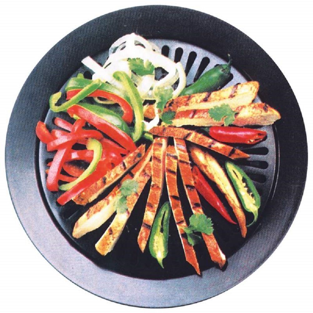 Round smokeless grill dish with colorful vegetables on black ridged grate