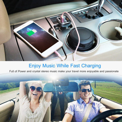 Car FM transmitter plugged into car socket, USB cable connected to a phone