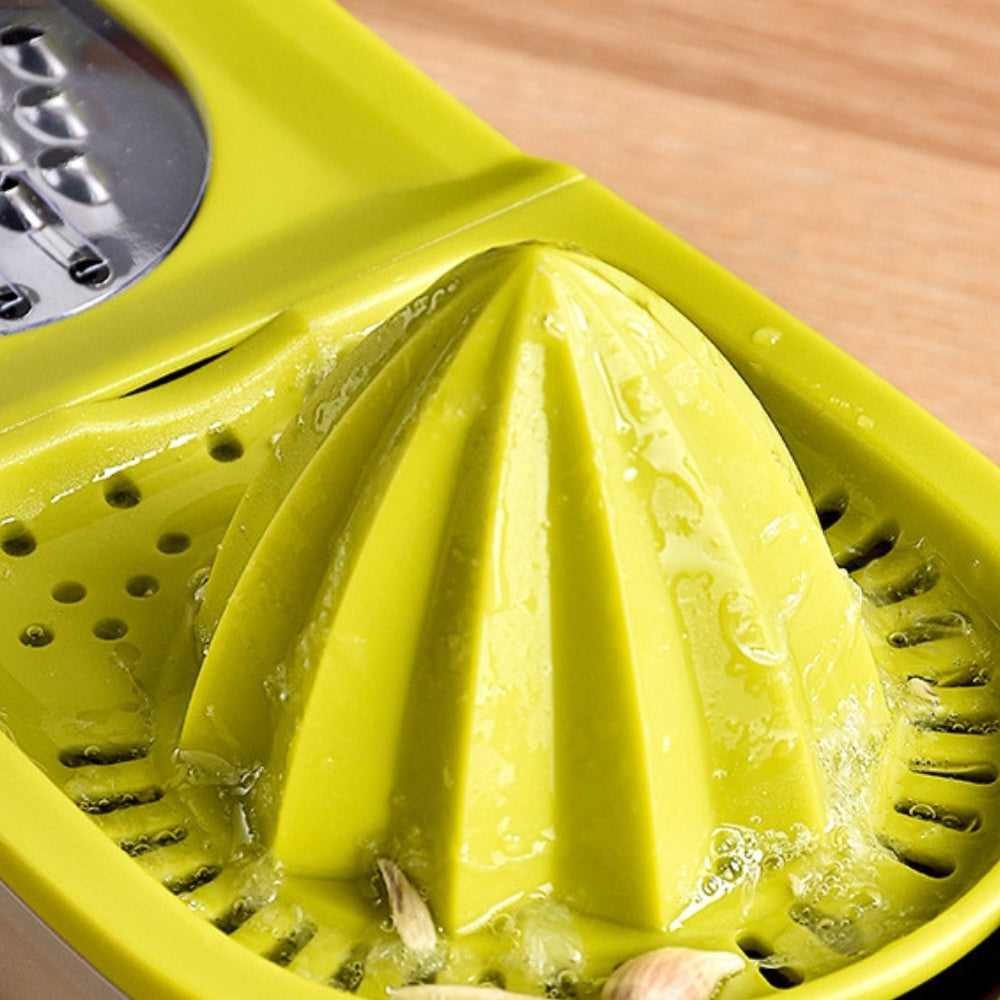 Close-up of green cone reamer with juice holes and grater openings on juicer