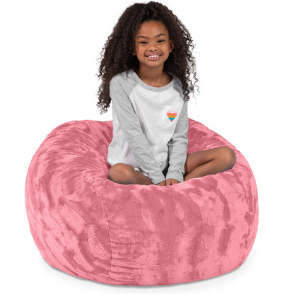 Rose Quartz faux fur bean bag chair with a child seated on the bean top.