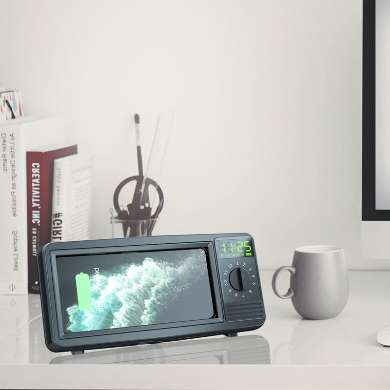 Black retro TV-style Bluetooth speaker/clock with screen, dial, and alarm time