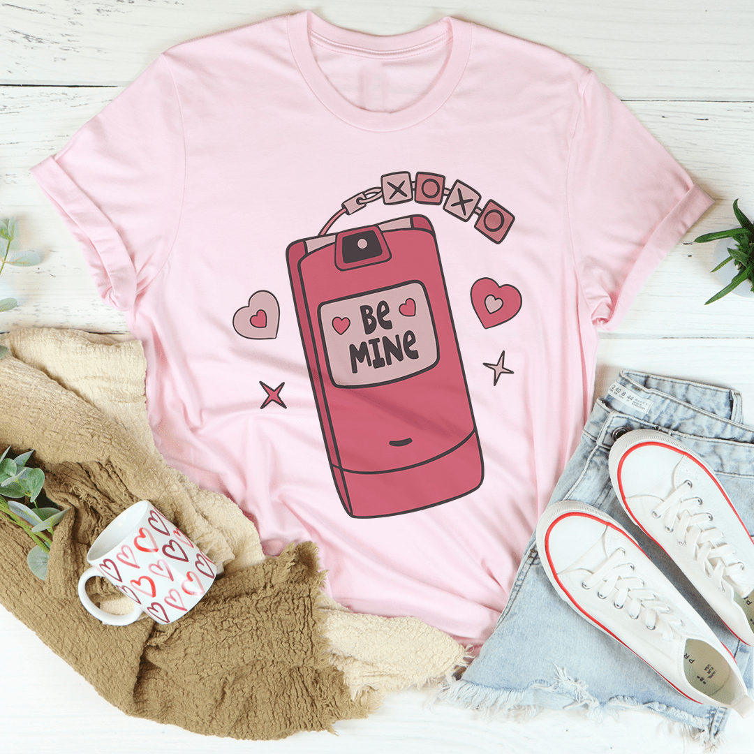 Pink flip phone graphic t-shirt with heart accents on the front