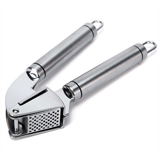 Stainless steel garlic press tool with perforated crushing plate and handles.