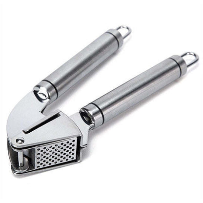 Stainless steel garlic press tool with perforated crushing plate and handles.