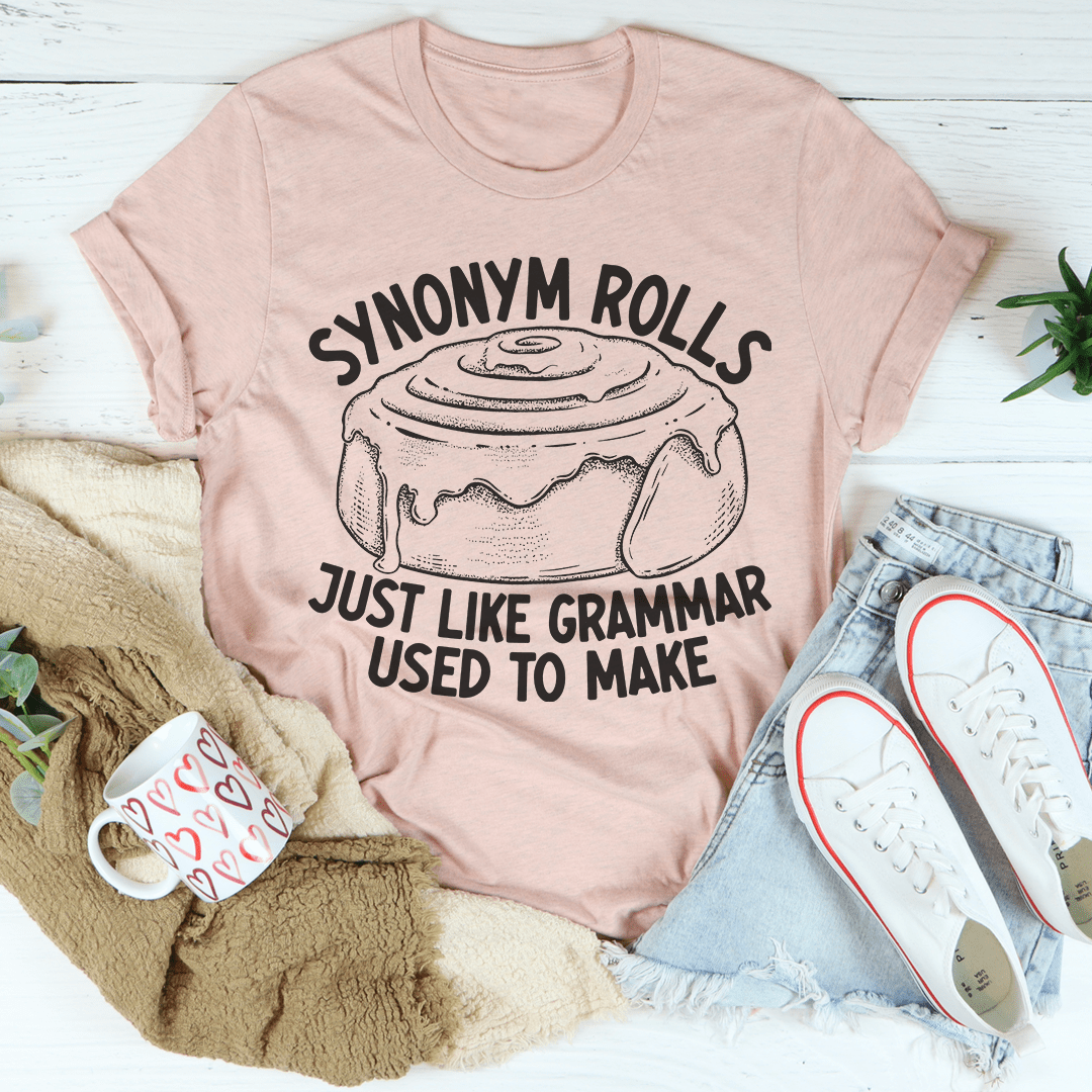 Mauve graphic T-shirt with "SYNONYM ROLLS" and "JUST LIKE GRAMMAR USED TO MAKE".