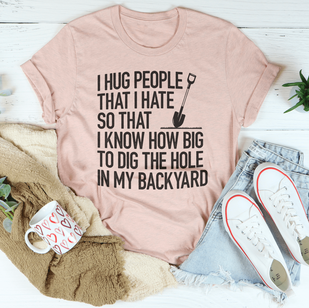 Heather pink graphic T-shirt with front text "HUG PEOPLE THAT I HATE"