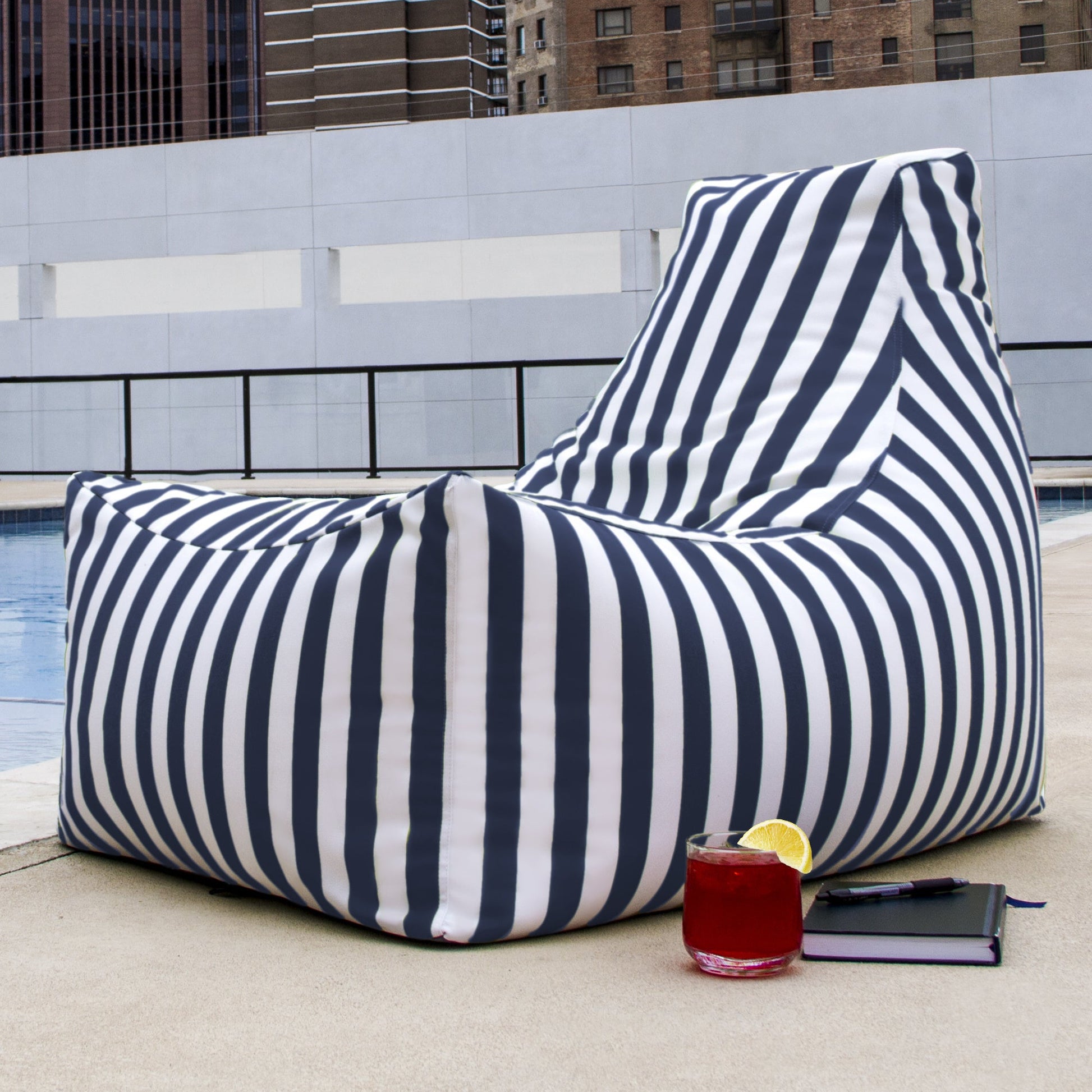 Navy-striped outdoor bean bag chair with wide lounge backrest and rounded base