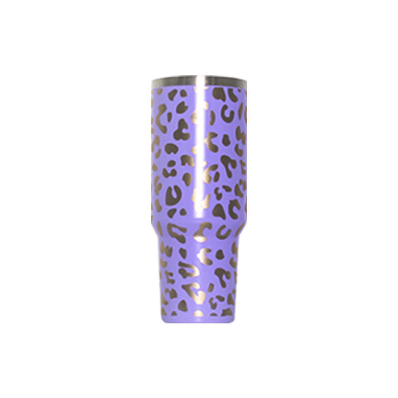 Purple leopard-pattern travel tumbler with handle and clear lid, straw-ready