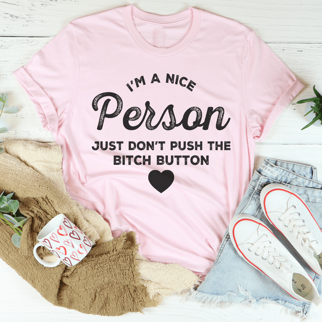 Pink crewneck T-shirt with front typography and heart graphic, short sleeves.