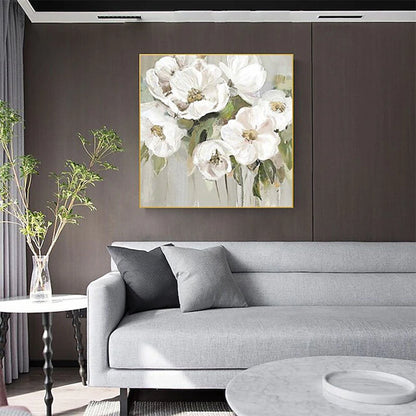 Framed floral oil painting of white blossoms with gold centers and green leaves
