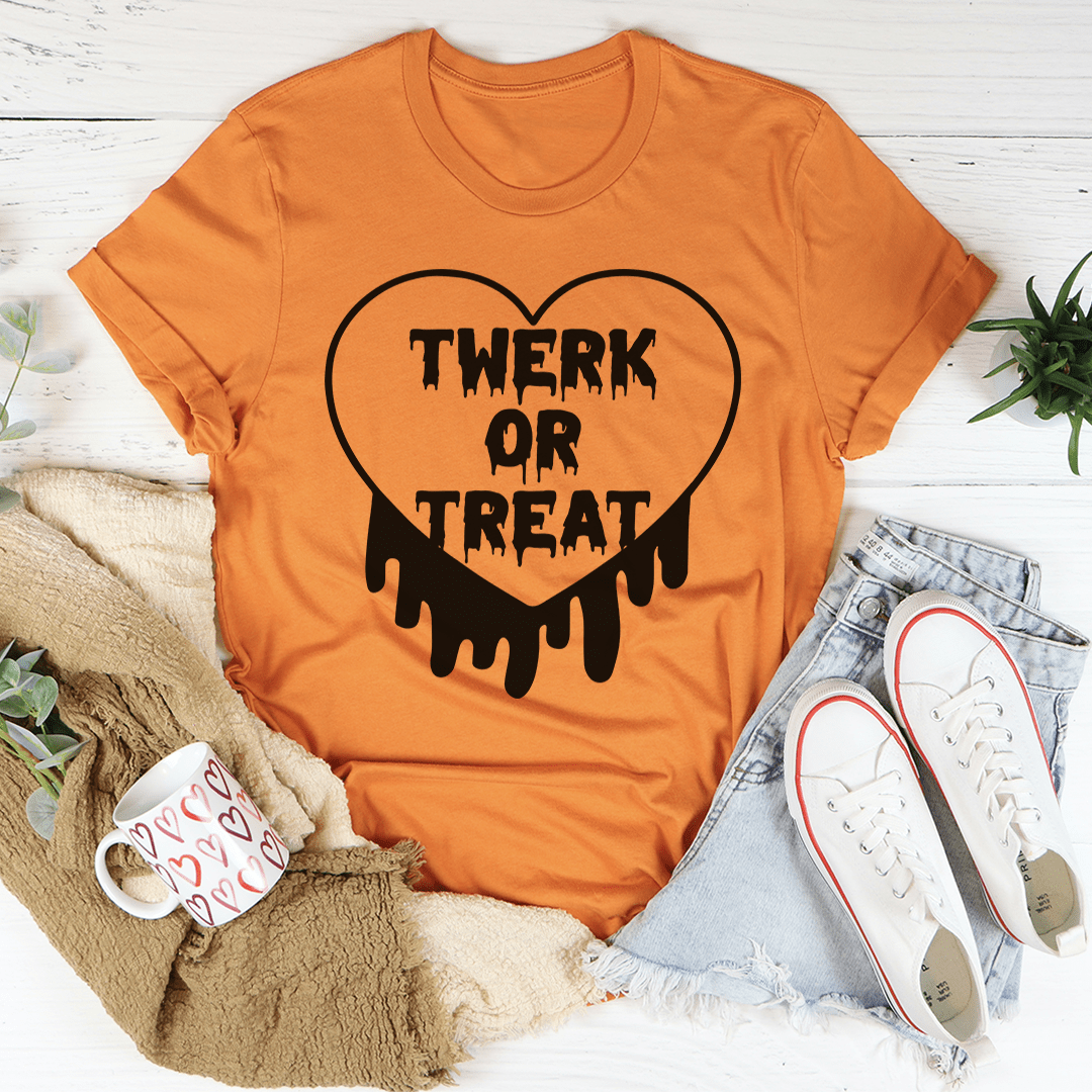 Twerk Or Treat graphic tee in burnt orange, black heart "TWERK OR TREAT" drip print