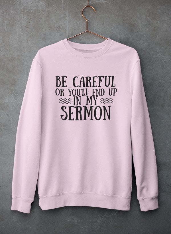 Pink pullover hoodie with 'Be Careful' text graphic on front