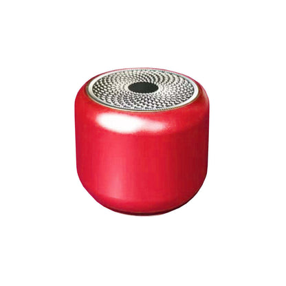 Red round pocket Bluetooth speaker with circular top speaker grille