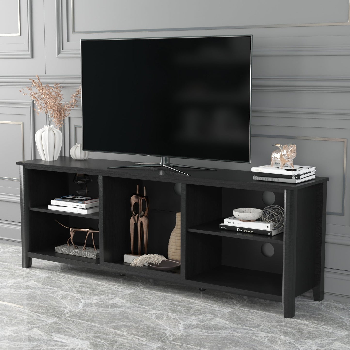 Black TV stand storage console with open shelves and center media cubby for devices.