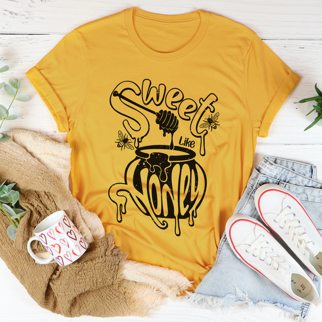 Mustard yellow crew-neck T-shirt with black dripping honeycomb graphic, short sleeves