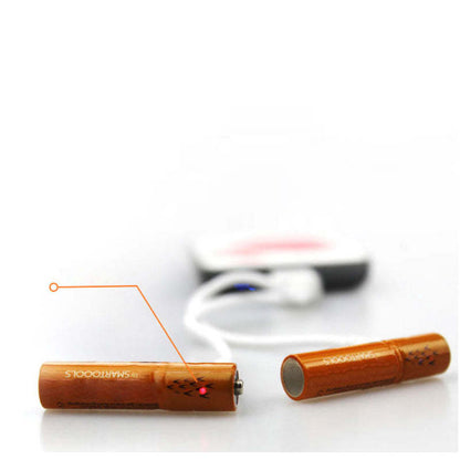 Orange rechargeable batteries close-up, showing contacts and USB port end