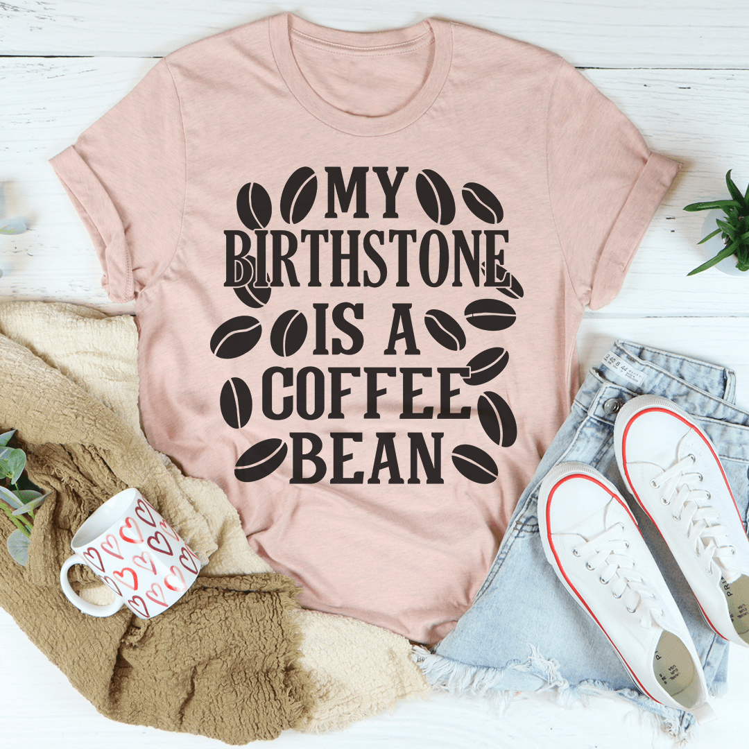 Mauve T-shirt with black coffee bean graphic and text design, crew neck short sleeves