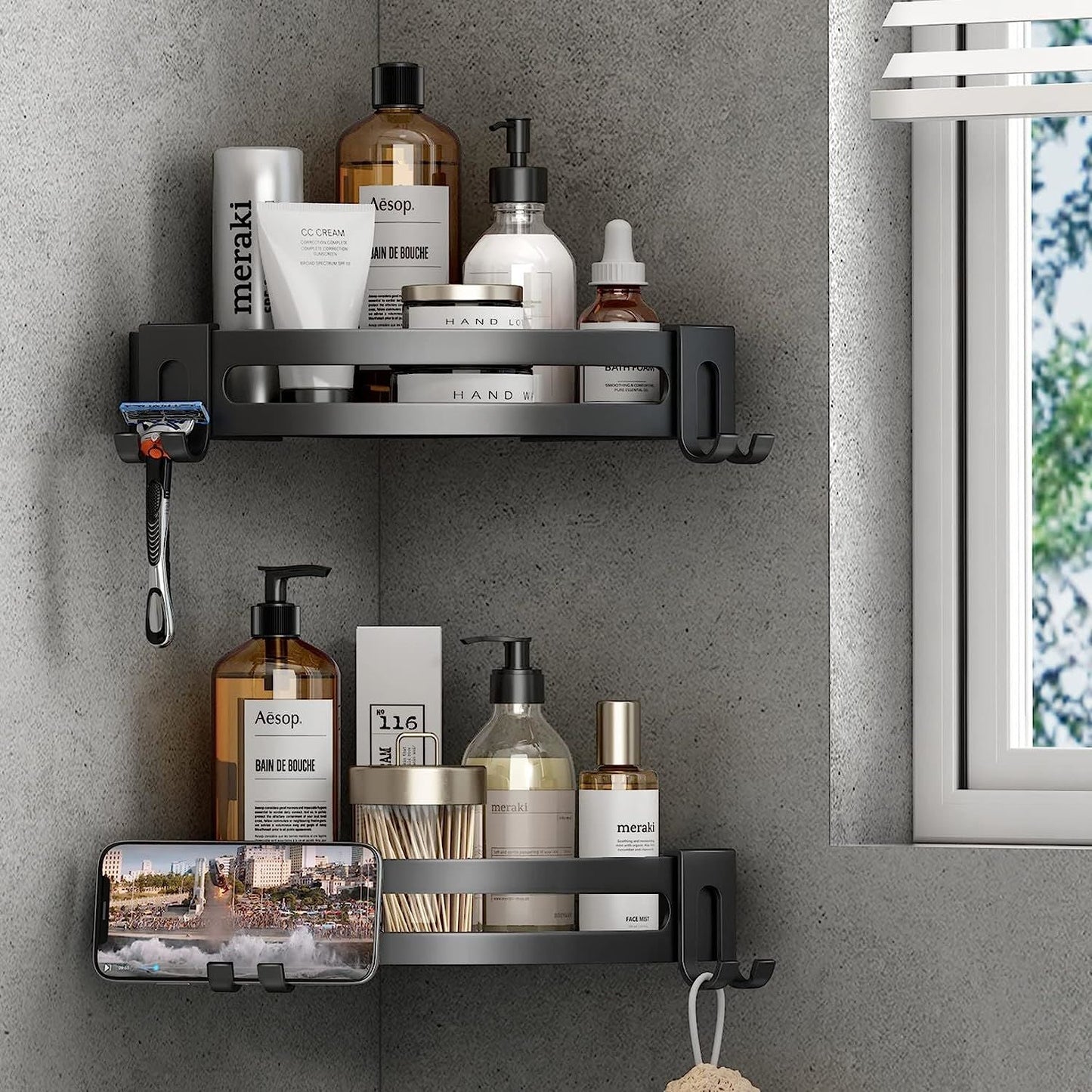 Black corner shower shelf caddy with two-tier storage and side hooks for toiletries