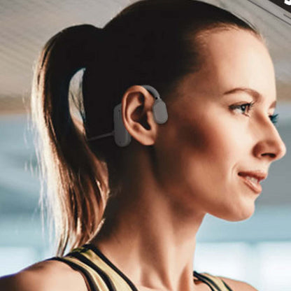 Open-ear wireless headphones worn on ear, showing earhook and small mic tip