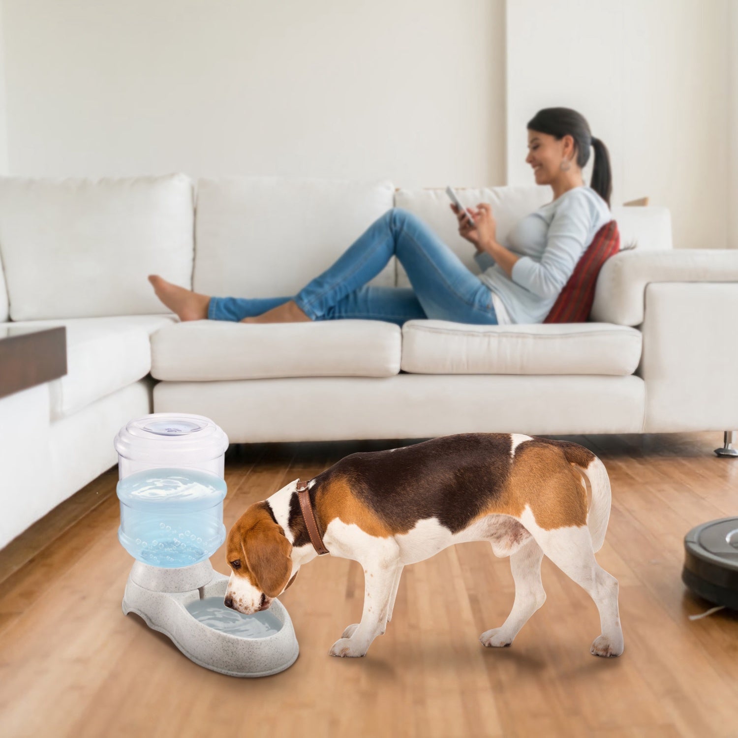 Pet water dispenser with clear barrel and speckled gray base; dog drinking from bowl