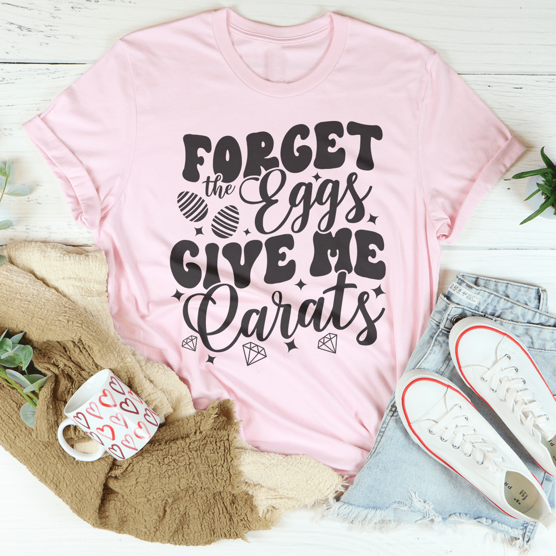 Light pink t-shirt with "Forget the Eggs Give Me Carats" graphic on front