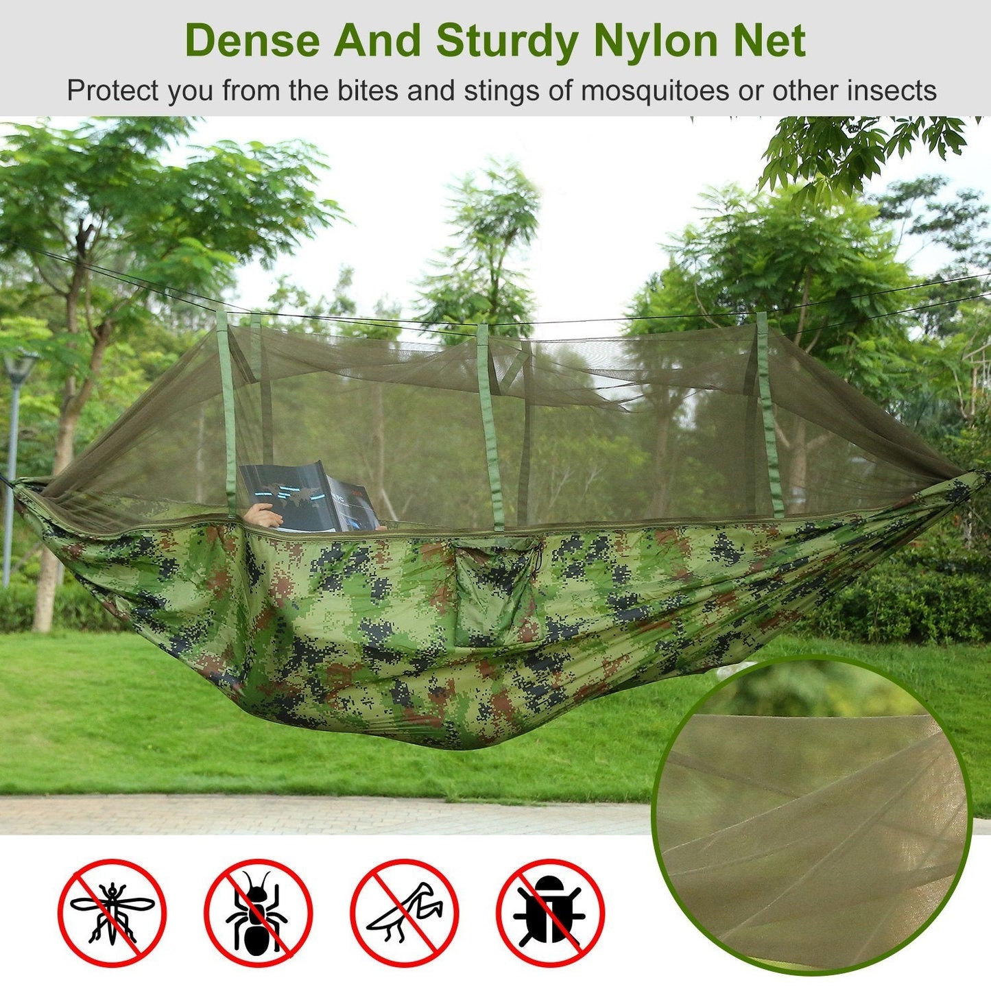 Green camouflage hammock with mosquito net stretched between trees