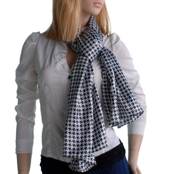 Silk scarf with black-and-white houndstooth plover pattern, draped on model