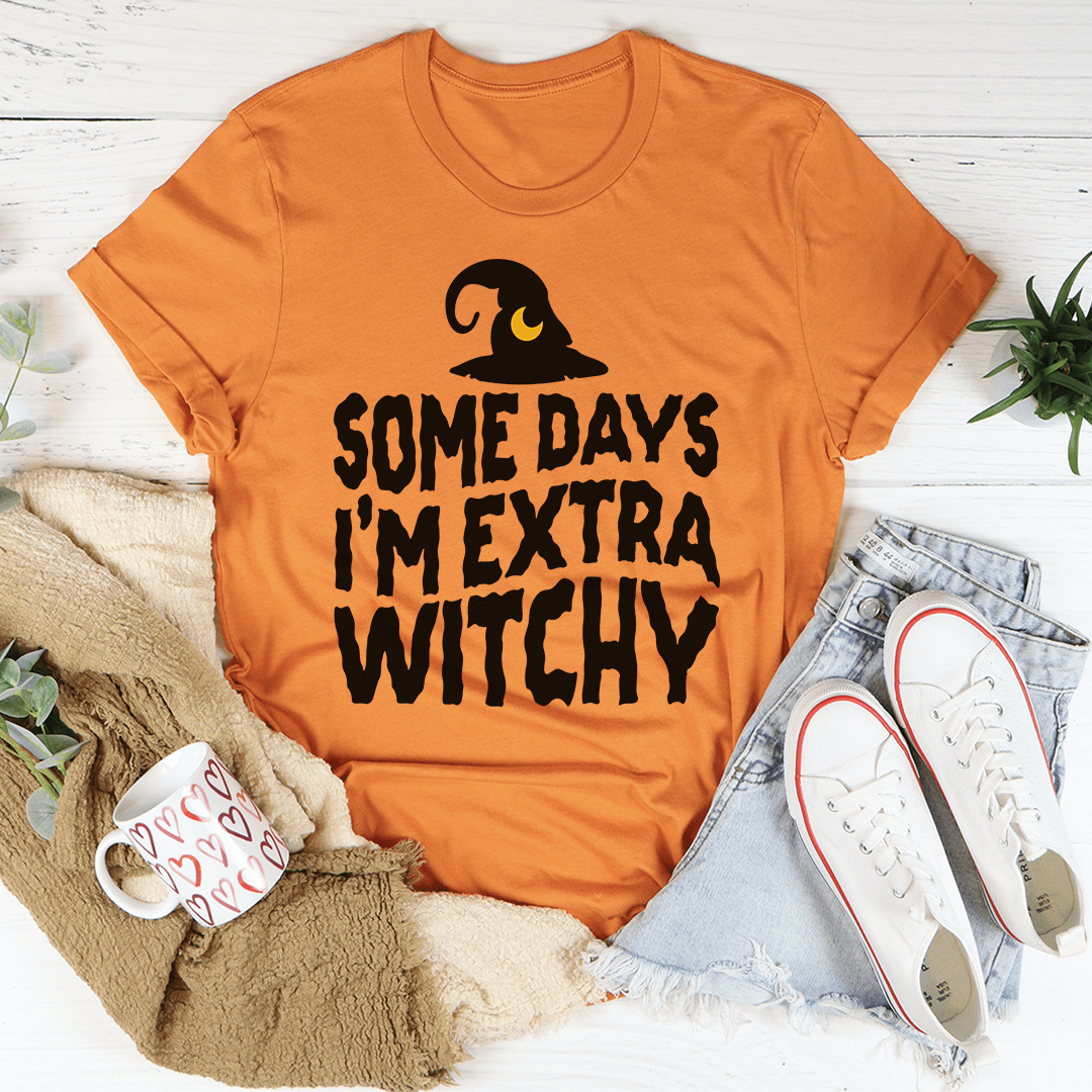 Burnt orange witchy T-shirt with black “Some days I’m extra witchy” hat text graphic