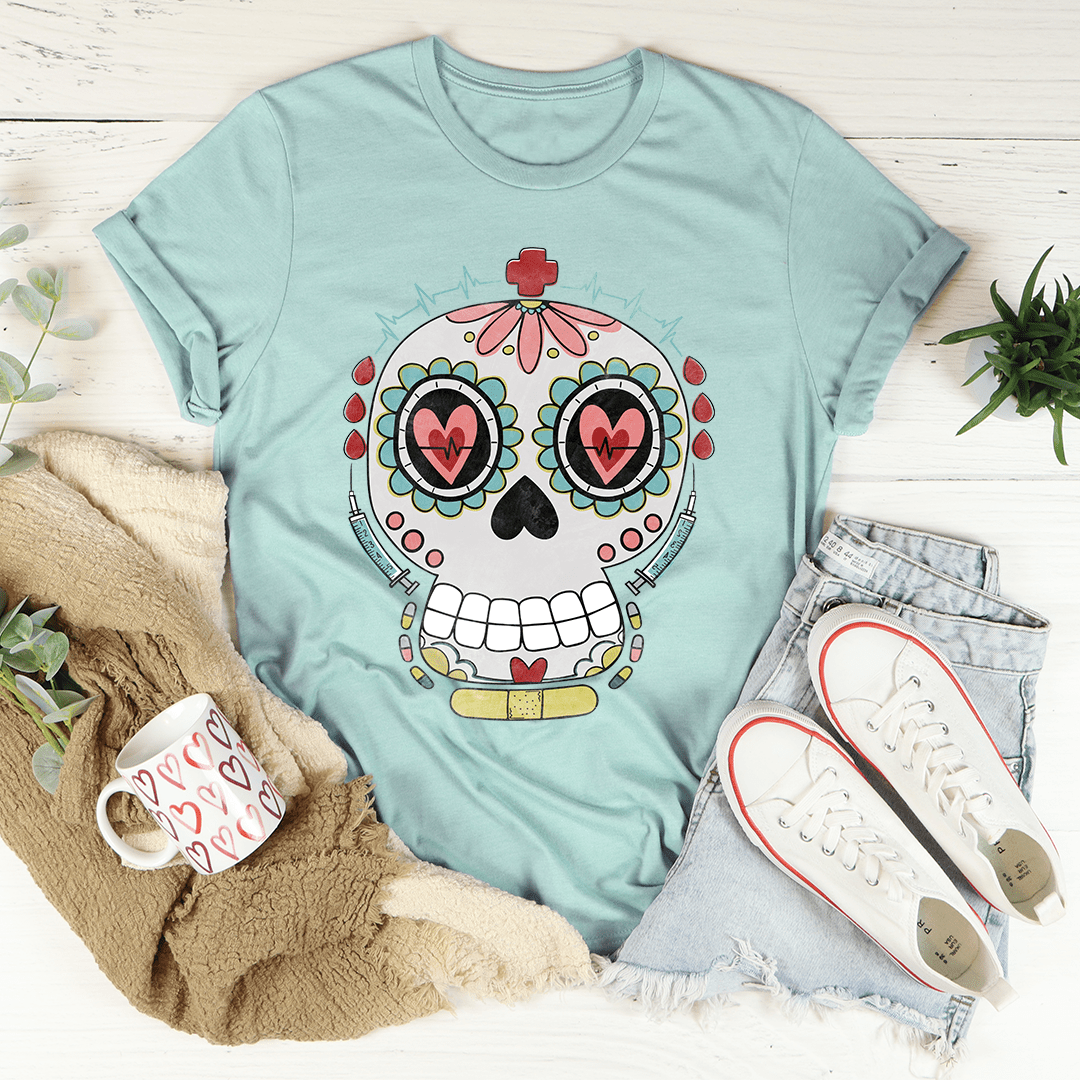 Teal T-shirt with nurse-style sugar skull graphic in red, teal, and yellow
