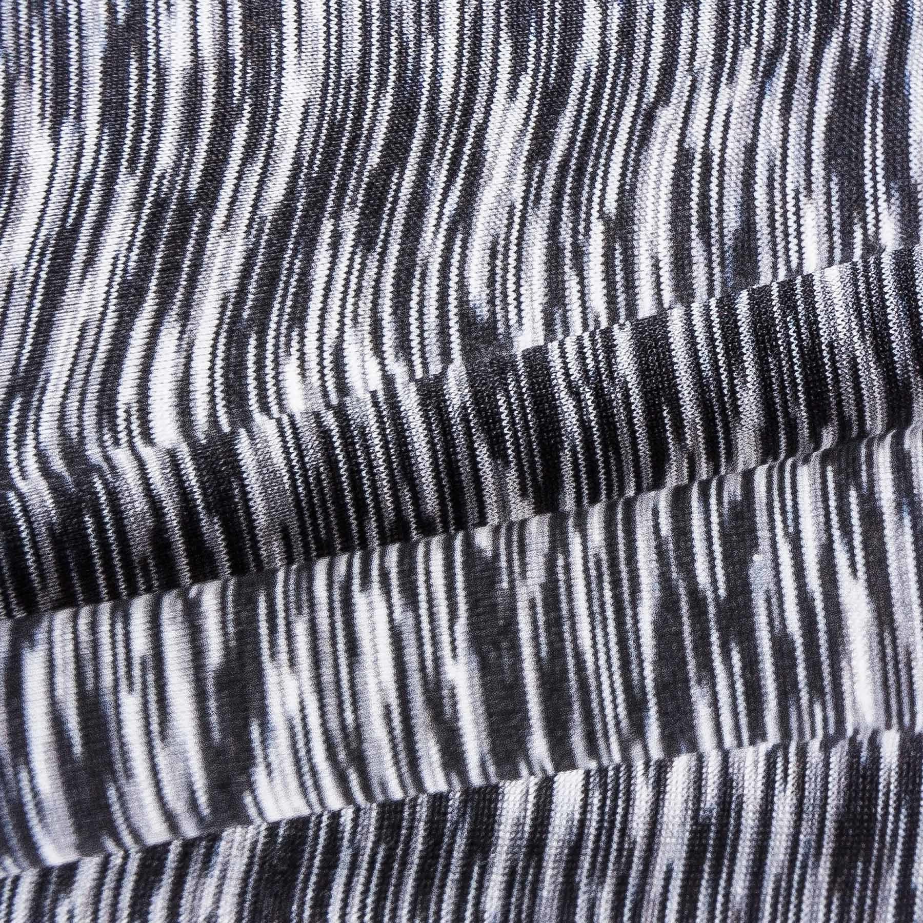 Heathered knit hoodie fabric closeup with dark contrast trim and seam lines