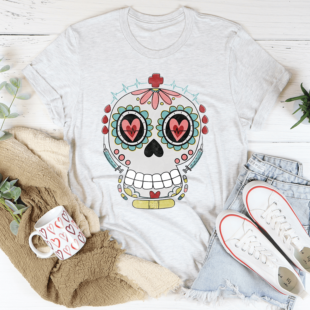 Ash T-shirt with nurse-style sugar skull graphic in red, teal, and pink