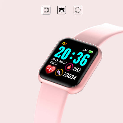 Smart watch on pink silicone band, square display showing time and activity ring