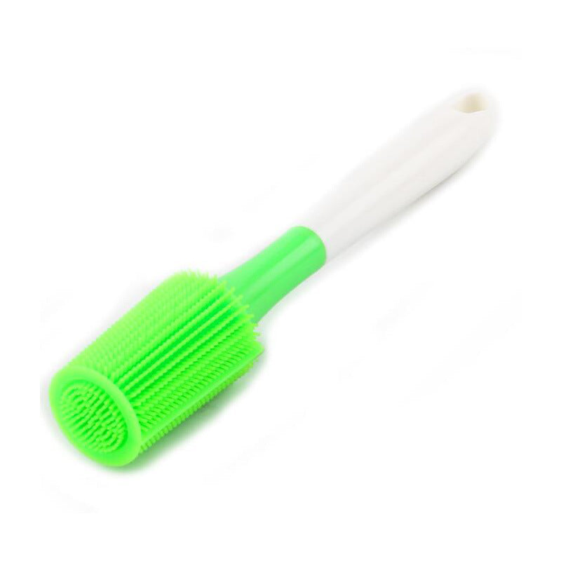 Silicone bottle cleaning brush with long white handle and bright green cylindrical scrubbing head