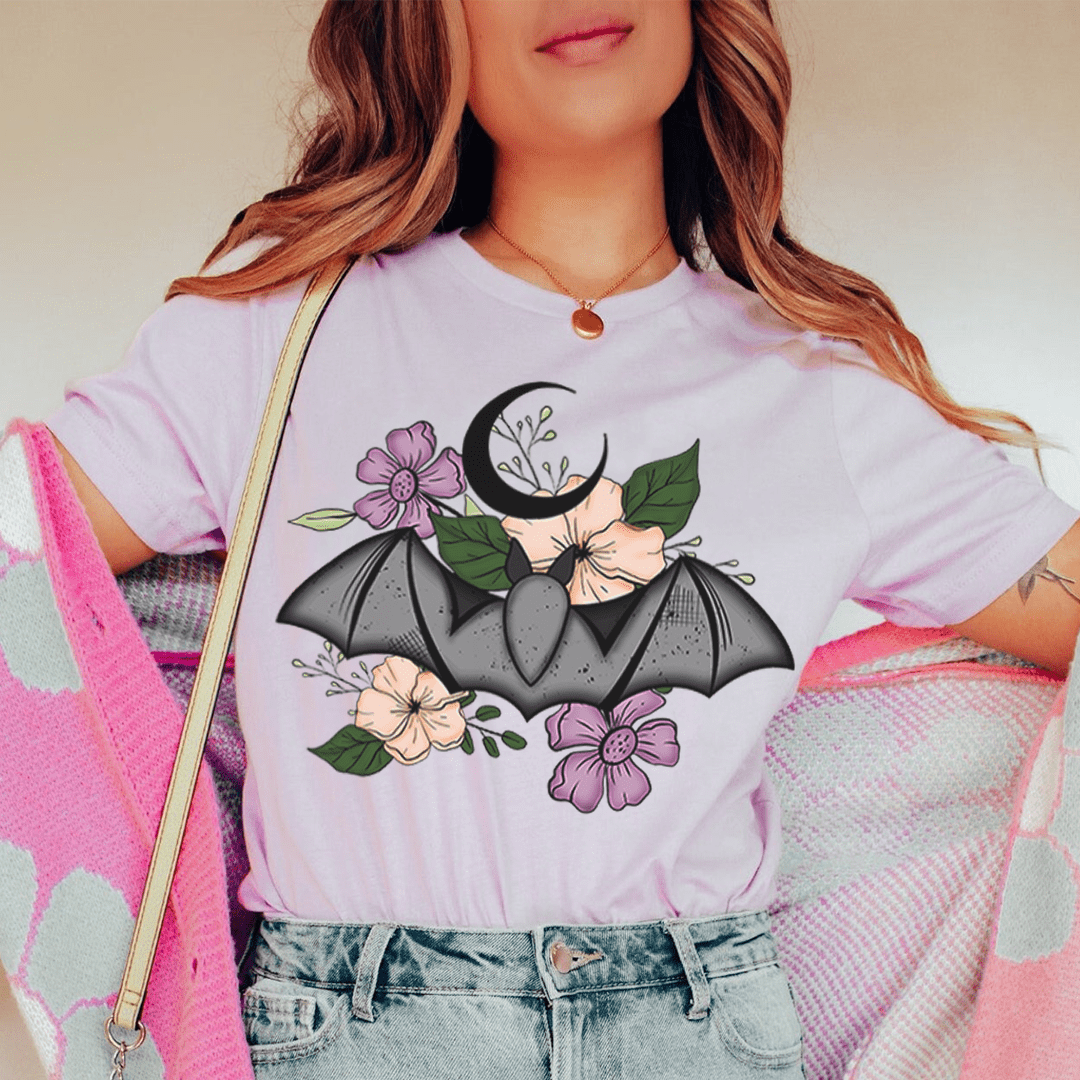 Lilac floral bat T-shirt with black wings and pink flower and leaf graphic