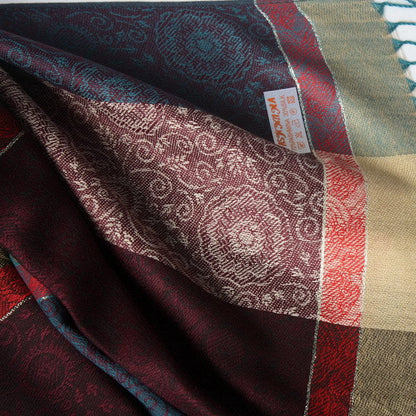 Pashmina scarf detail with burgundy floral pattern, teal border, beige stripe