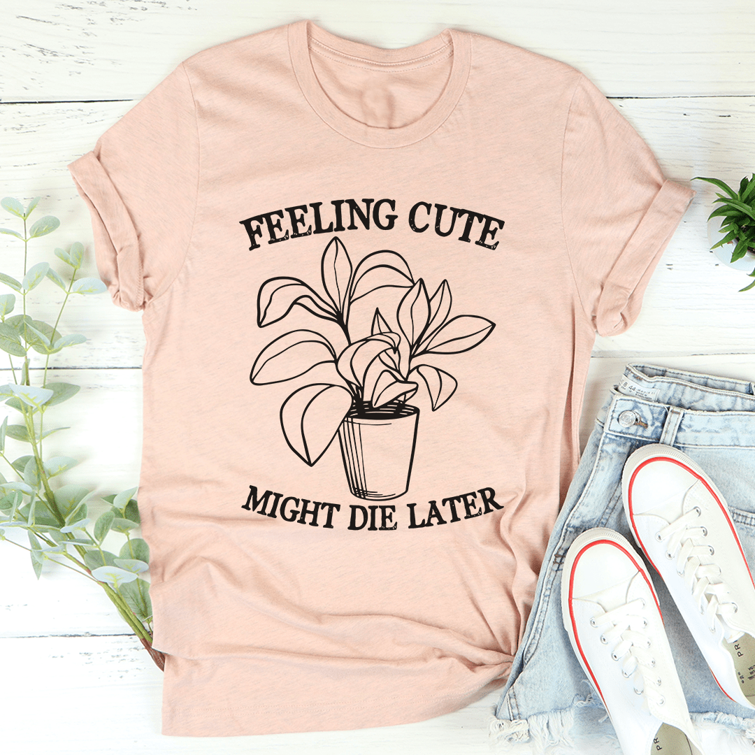 Peach short-sleeve T-shirt with potted plant graphic and lettering: FEELING CUTE, MIGHT DIE LATER