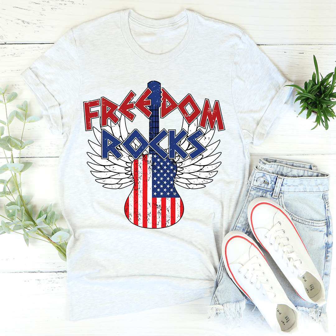 Freedom Rocks T-shirt in light heather with winged patriotic guitar graphic, crew-neck