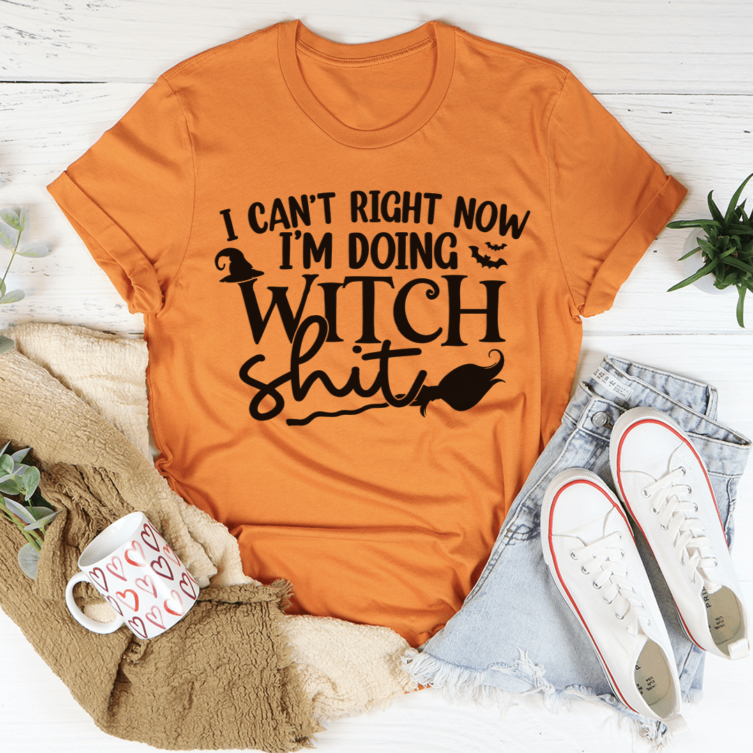 Burnt orange crewneck T-shirt with witch-themed word art in black