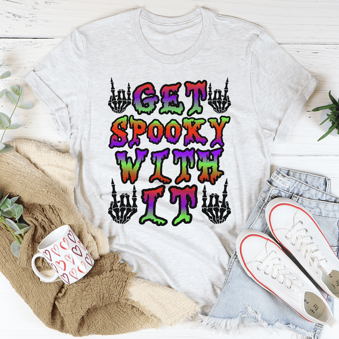 Light gray crewneck T-shirt with bold multicolor spooky text and skeleton hand icons