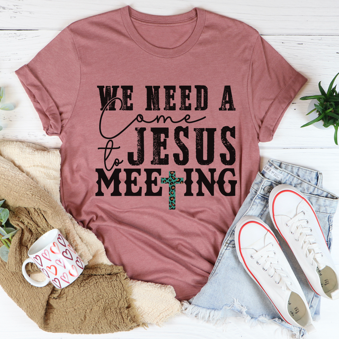 Mauve crewneck T-shirt with black 'Jesus meeting' text and teal cross graphic
